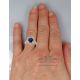 blue sapphire diamond ring on finger
