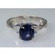 Blue gemstone and platinum ring