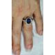 Oval cut sapphire ring in finger photo