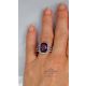 purple sapphire ring in finger 