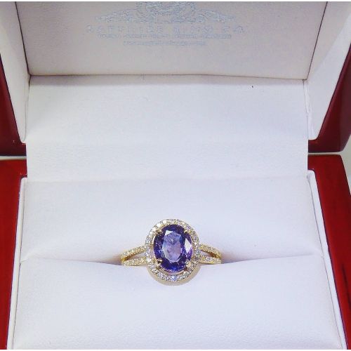 reddish purple sapphire and diamond ring in yellow gold 