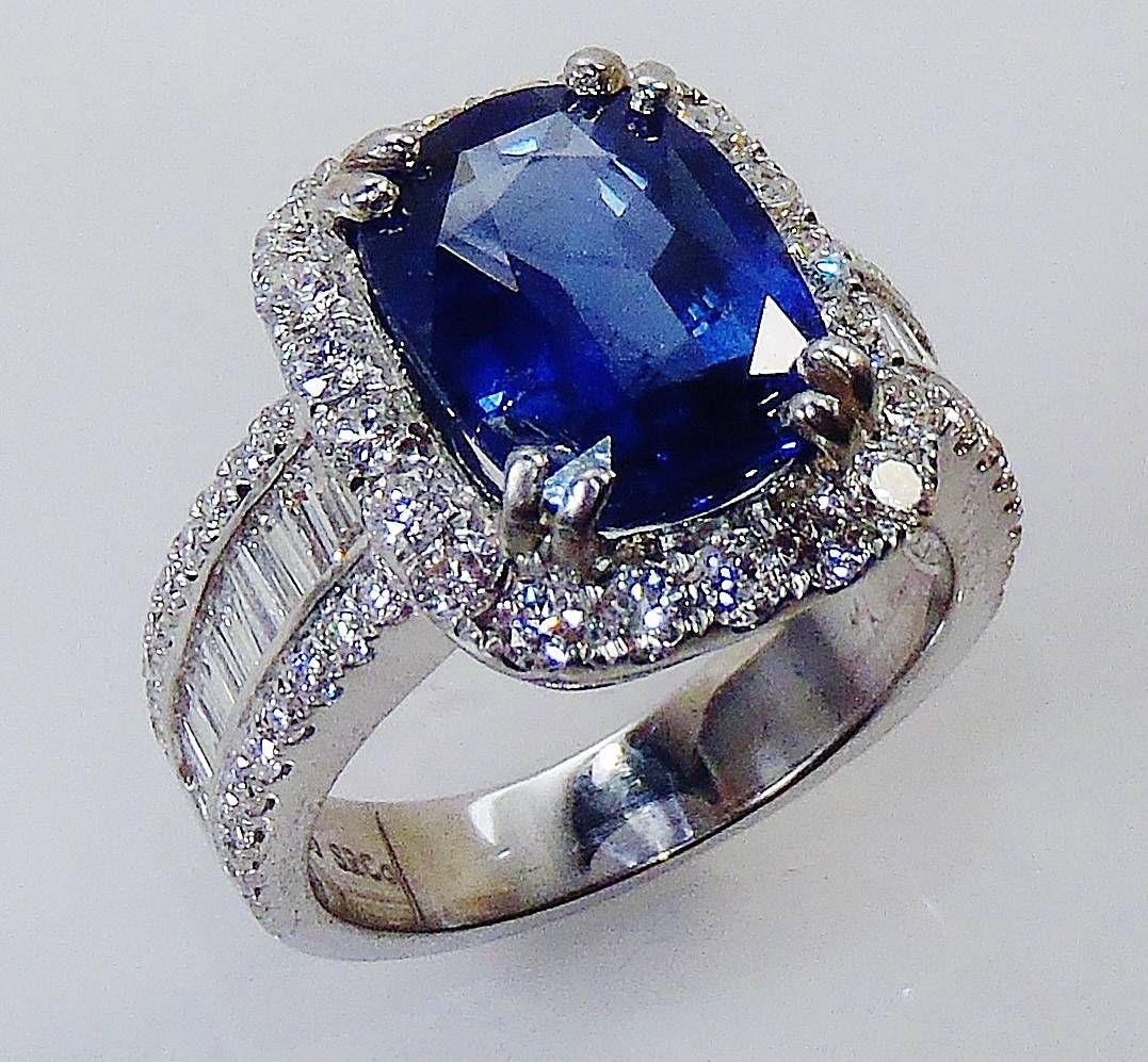 Ring with a 3.03-carat oval modified brilliant Fancy Intense Blue diamond  with white diamonds in platinum. - Tiffany